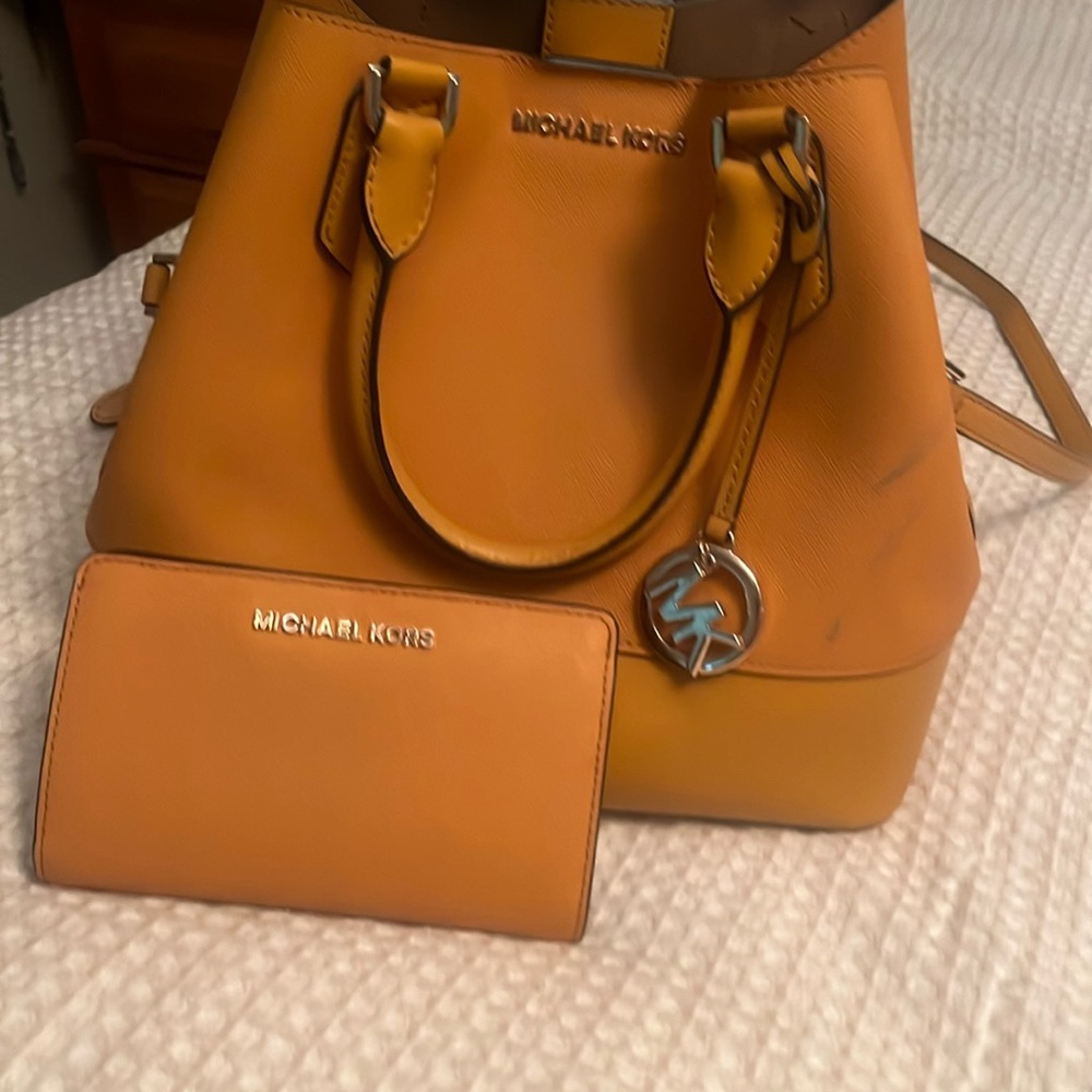 Michael Kors bag and wallet mustard in color